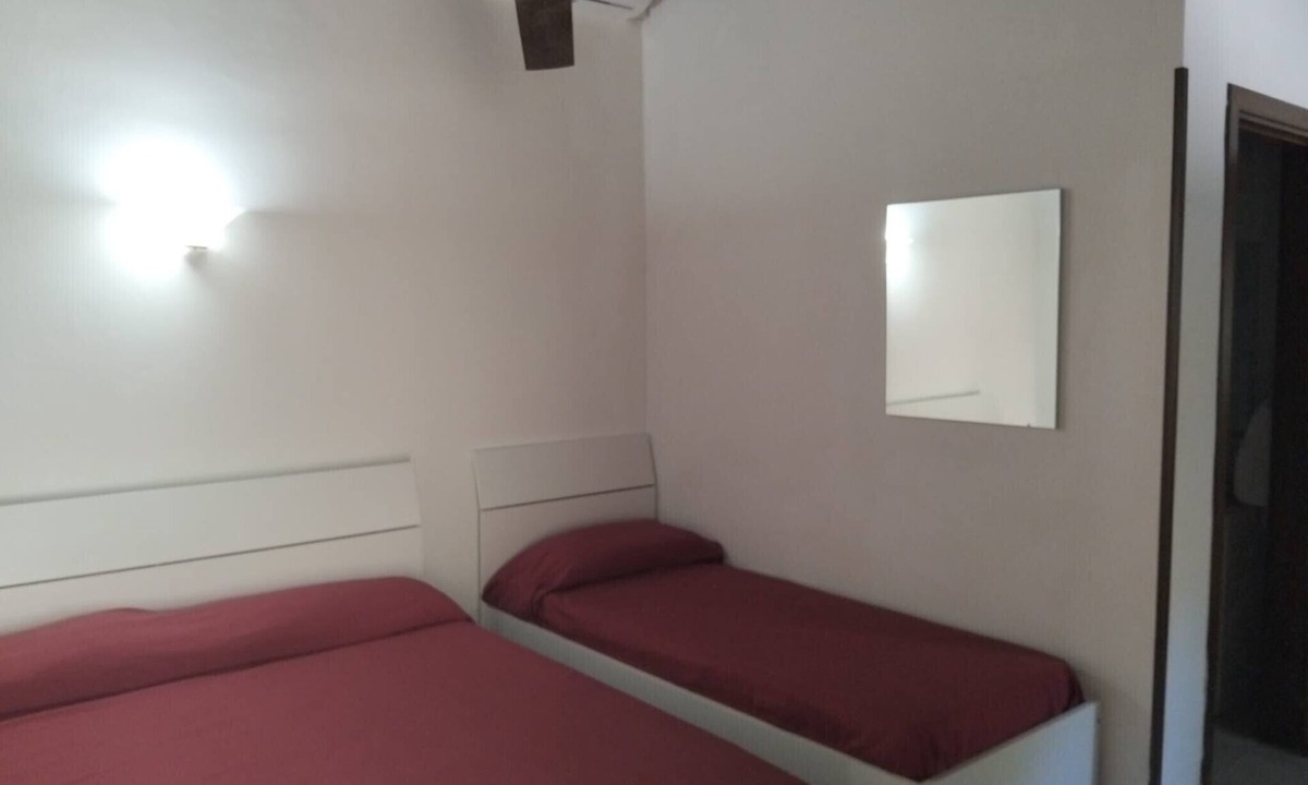 Caprioli Apartment | Room 'Camera Ulivo Vista Giardino' with Sea View, Wi-Fi and Air Conditioning