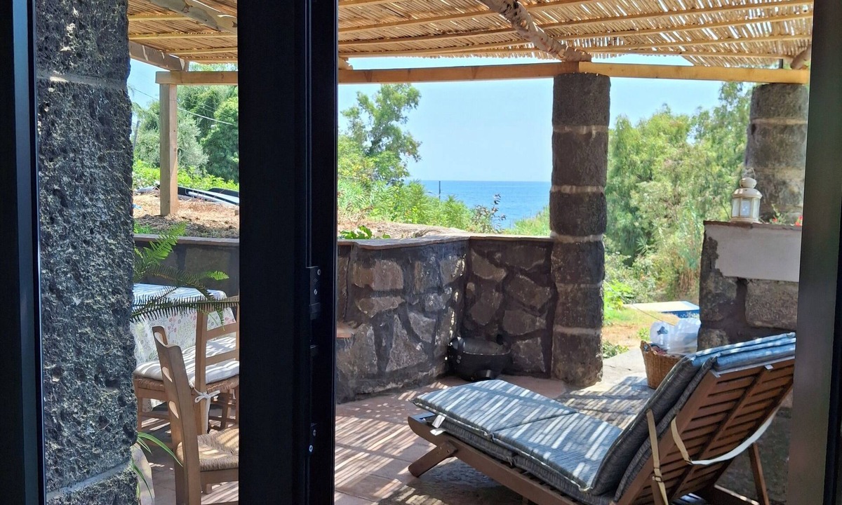 Carruba House | typical Sicilian stone house on the sea surrounded by greenery