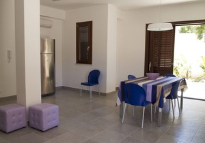 Elegant summer house in the shade of a centuries-old carob