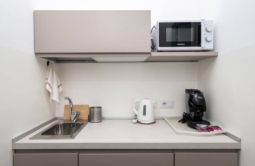 Sant'Agnello Apartment | A sense of calm defines the experience from the very first step inside. La Perla Rara is located in a well-kept residential building along Viale dei Pini, a quiet and elegant area just a short walk from the center of Sant’Agnello. The interiors are bri