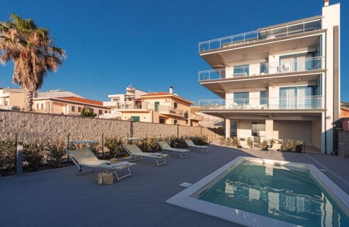 Capo d'Orlando Apartment | Ambra - 1-bedroom apartment with large lateral sea view terrace and pool in the garden