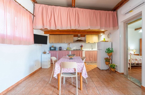 Granelli Apartment | Apartment 'Nonna Rosa' with Private Terrace, Shared Garden and Air Conditioning