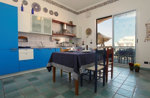 Marina di Ragusa Apartment | Bright apartment overlooking the beach and direct access to the sea