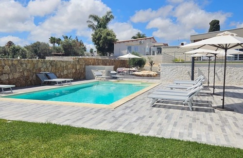 Brucoli Apartment | Cava Del Mar: comfort and relaxation in a vacation home with bedroom, living room and bathroom.