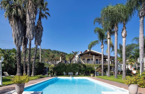 Macchia House | Fantastic vacation home with paradisiacal garden at the foot of the volcano Etna.
