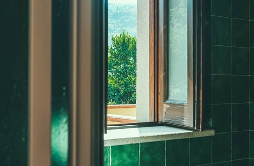 Naso Apartment | Fattoria San Pio - Pompelmo Room with Mountain View, Breakfast & Wi-Fi