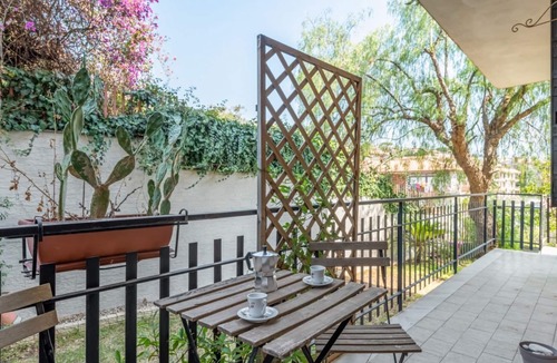 Aci Trezza Apartment | GuestHost - Spacious 120 sqm apartment in Aci Castello, ideal for 6 people. Features a balcony, private garden, and air conditioning. Aci Castello is a picturesque coastal town in Sicily, famous for its charming Norman castle by the sea. Perfect for thos