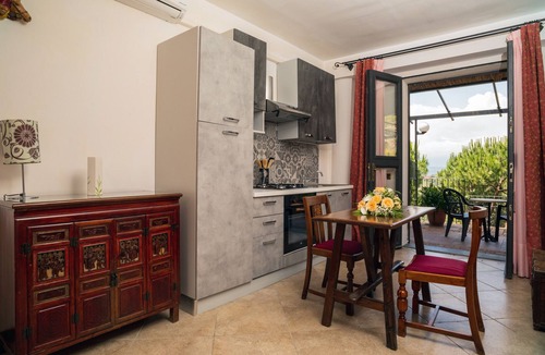 Castelmola Apartment | Holiday Apartment 'Garden Cottage I Dammusi - Arancio' with Mountain View, Shared Pool & Wi-Fi
