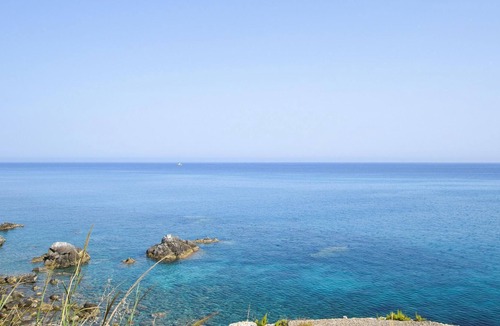 Scilla Apartment | Look forward to a beautiful view of the sea in this beachfront vacation rental.