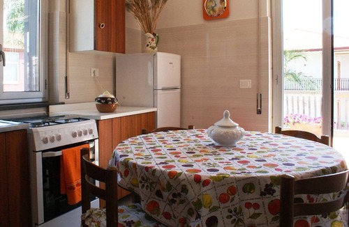 Stazzo House | Marigrè: A beautiful beach house with a solarium, wooden walkway, sun deck, and garden.
