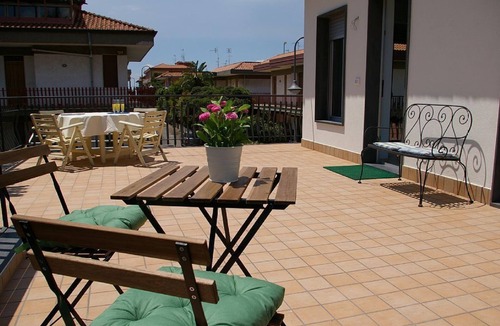 Stazzo House | Marigrè: A beautiful beach house with a solarium, wooden walkway, sun deck, and garden.