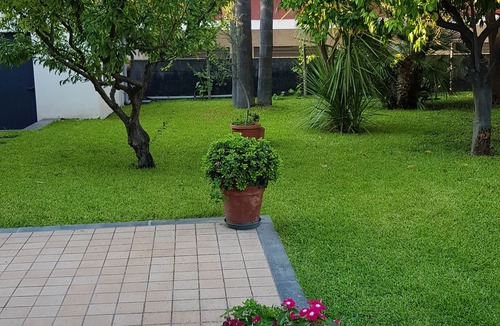 Stazzo House | Marigrè: A beautiful beach house with a solarium, wooden walkway, sun deck, and garden.