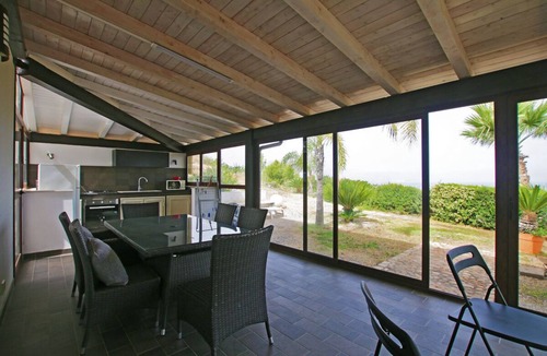 Campofelice di Roccella Villa | Modern Villa with Private Golf Practice, Pool, Garden, Terrace, Wi-Fi, Sea View