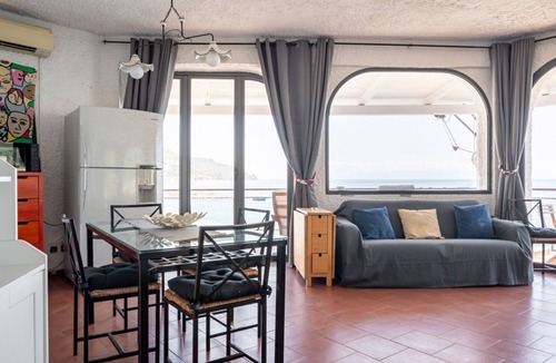 Spisone Apartment | Sea view apartment of about 90 sqm, able to accommodate up to 4 people, located on the ground floor of a building.The property is located in Taormina, in a unique panoramic position, suspended above a rock and with the beach right in front of the apartme