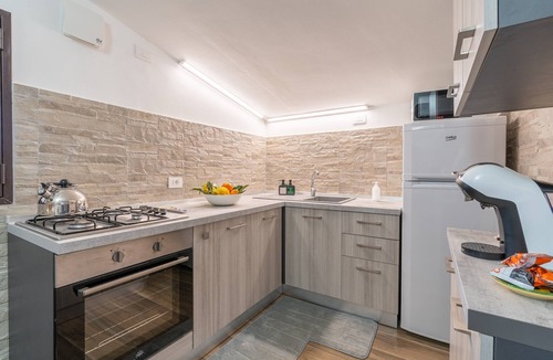 Agnone Bagni Apartment | Seaside Apartment 'Trifamiliare Garden - Conchiglia' with Private Terrace, Wi-Fi & AC