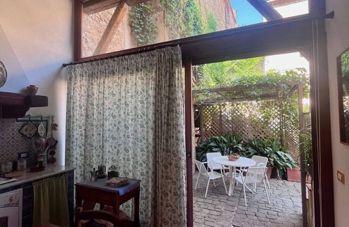 Castelbuono House | The Little House in the Courtyard, cozy vacation home with private courtyard in the center