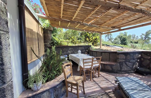 Carruba House | typical Sicilian stone house on the sea surrounded by greenery