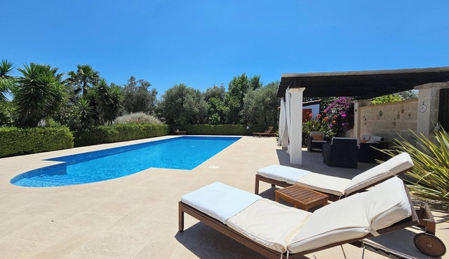 Delightful villa with pool in landscaped gardens.
