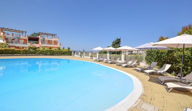 Enjoy a wonderful sea view in this vacation apartment with community pool.