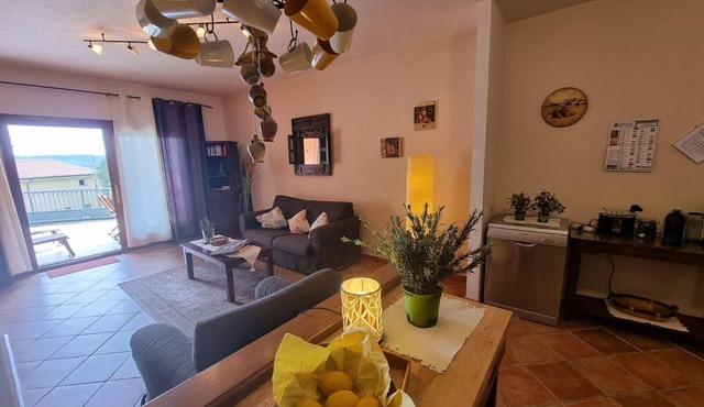 Holiday flat with fireplace, terrace and sea view in Posada