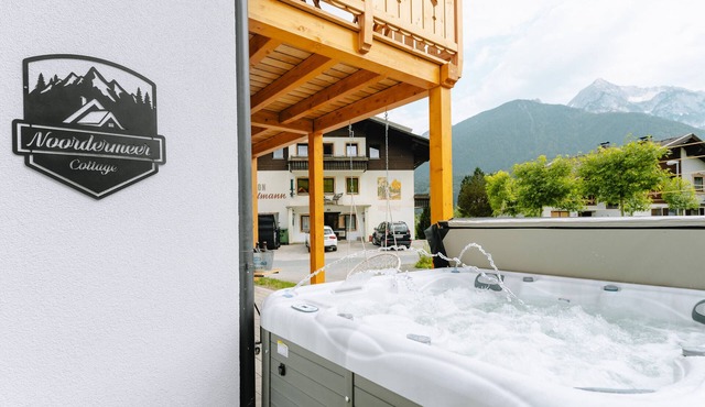 Holiday home 'Bubbelen Aan De Piste' with mountain view, terrace, jacuzzi and WiFi in Kötschach