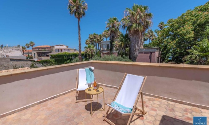 Santa Lucia Apartment | Sunset terrace apartment by Dimore in Sicily