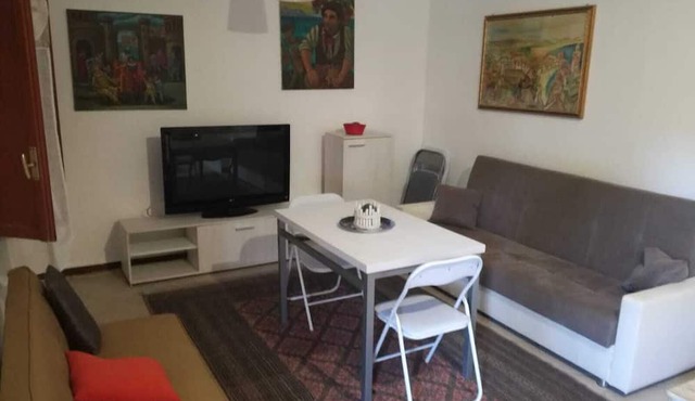 White house apartment with garden