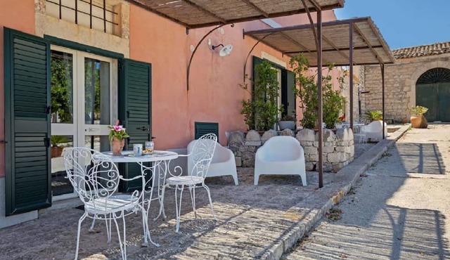 Room with kitchenette and veranda overlooking the farmyard
